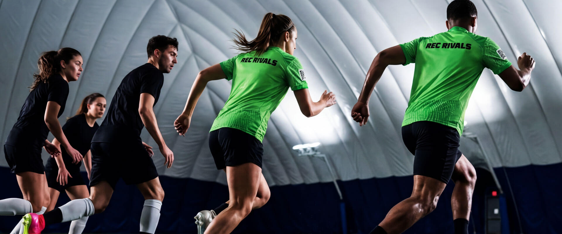 Adult indoor soccer league game in Mississauga sports dome with players in action